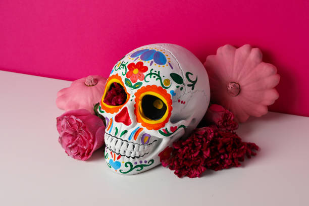 istock Mexican skull, zucchini and flowers on pink background 2170169521