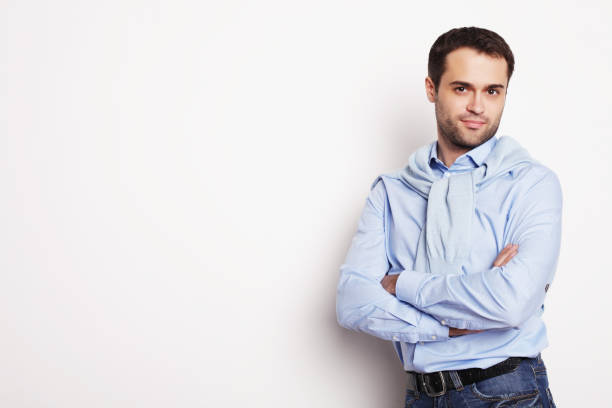 istock happy young man in blue shirt. 2170169842