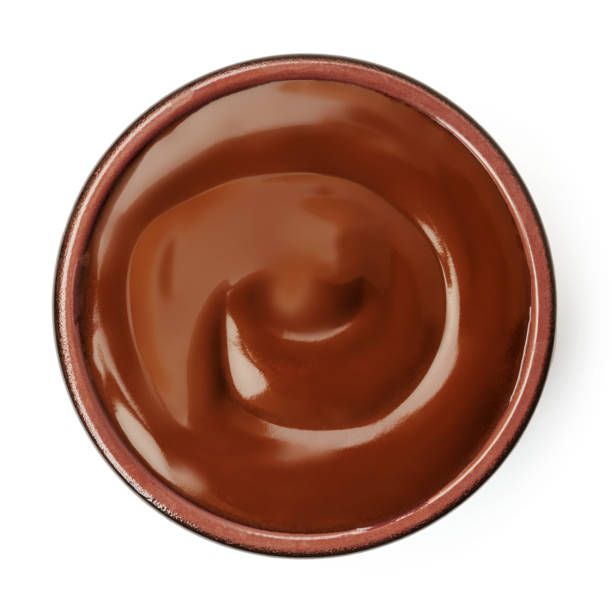 istock Melted chocolate in a bowl isolated on white background. Flowing  Chocolate spread top view. Flat lay 2170171189