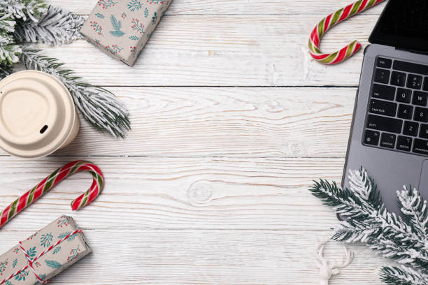 istock Candies, gift boxes, paper cup and laptop on wooden background, space for text 2170174631