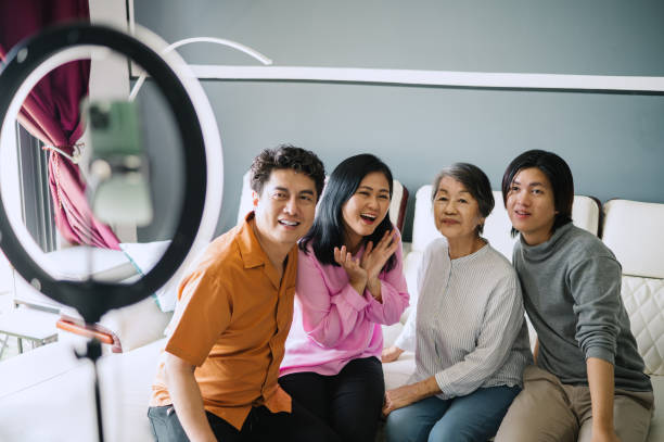 istock Asian family dancing while vlogging at home. 2170175203