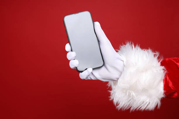istock New year concept, Santa's hand with smartphone 2170175439