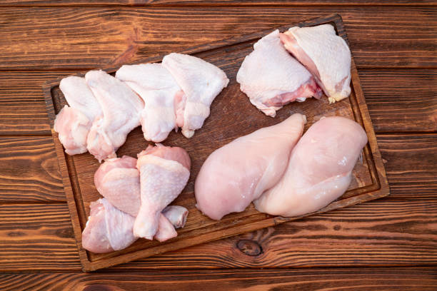 istock Raw mixed chicken meat parts  for cooking on rustic background 2170175517