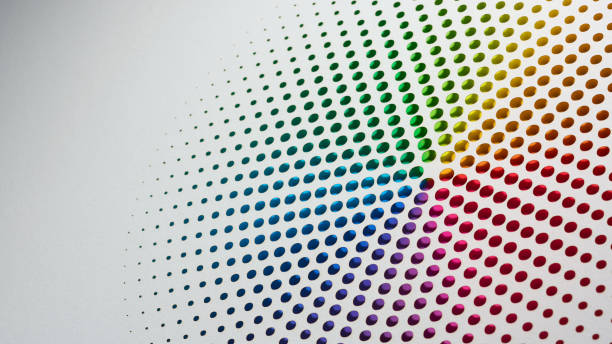 istock Colorful gradient paper art arranged in concentric circles of perforated dots on a white background 2170182066