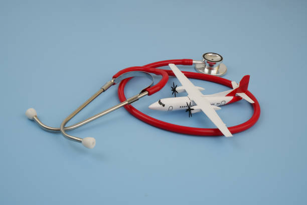 istock Airplane with red stethoscope on blue background. 2170184271