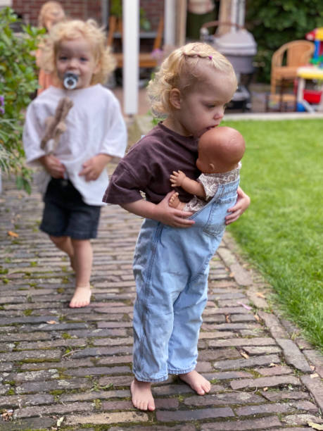 istock Fraternal Toddler Twin Playing in garden 2170185088