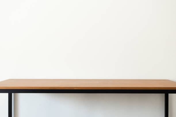 istock Wooden desk near white wall with copy space. Workspace or study desk concept 2170185253
