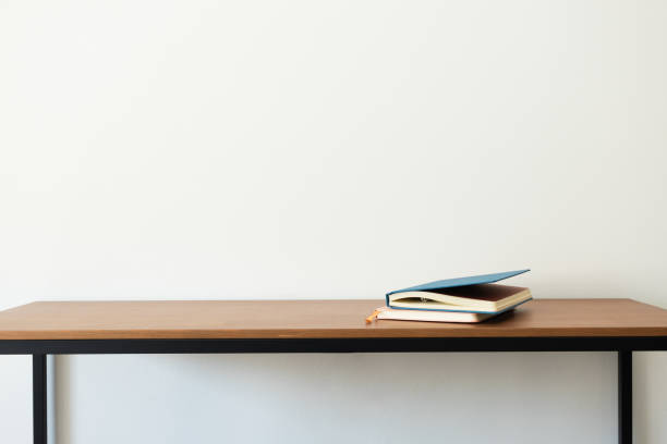 istock Notebooks on wooden desk, minimalist interior. Study or back to school concept 2170185264