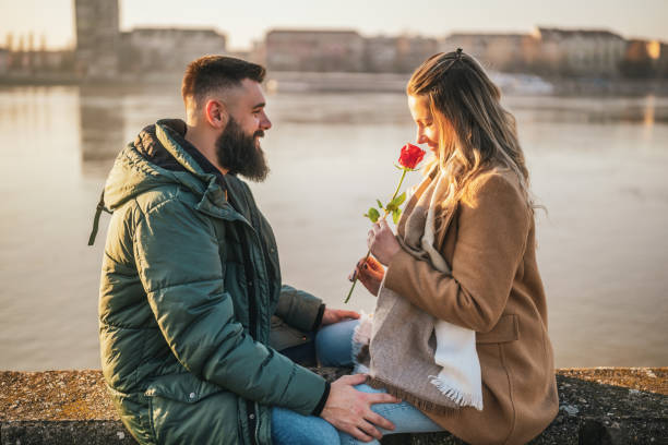 istock Man giving rose to his woman 2170186419