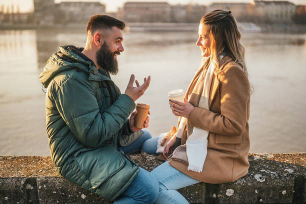 istock Couple drinking coffee outdoor 2170186429