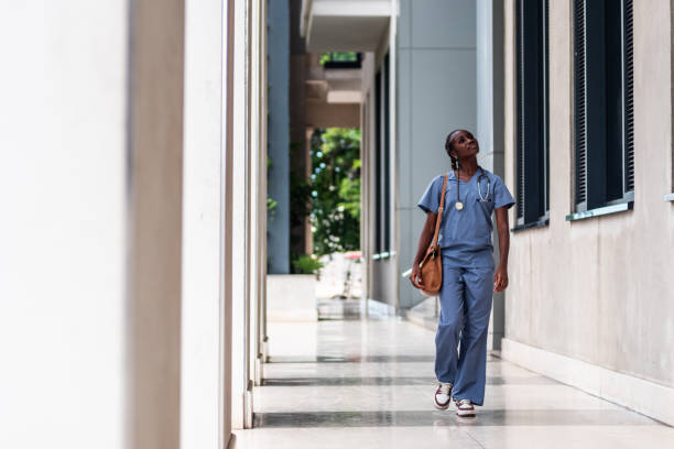 istock Female nurse walking street 2170193146