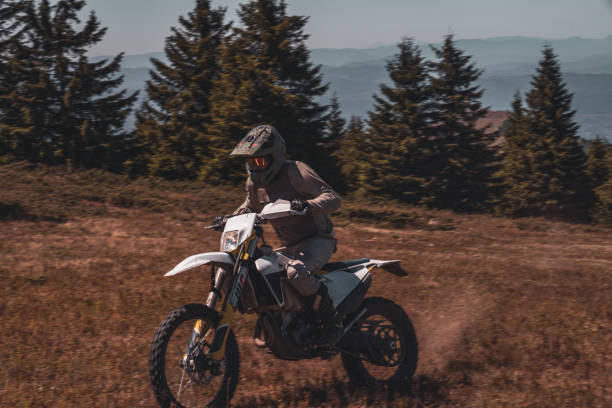 istock A motocross rider's adventure on a sunlit trail through the forest 2170194095