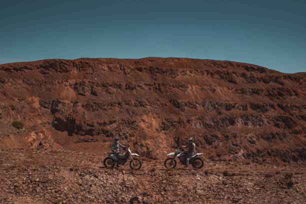 istock Motocross riders taking a break from riding 2170194188