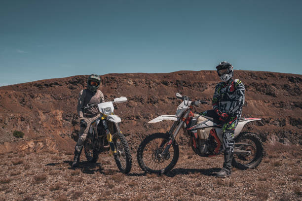 istock Two motocross bikers sitting on their bikes and looking at the camera 2170194331