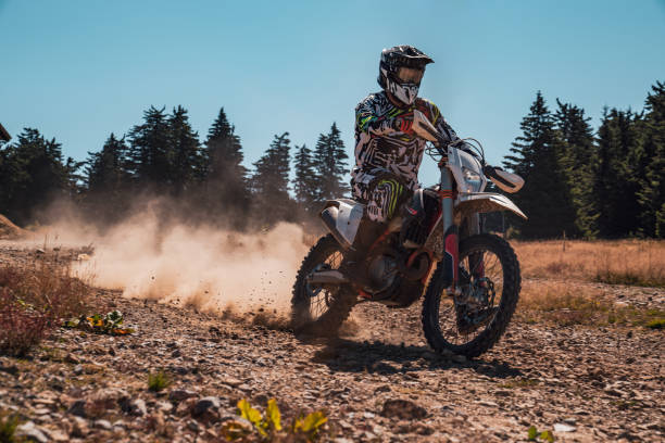 istock A motocross rider's adventure on a sunlit trail through the forest 2170194648
