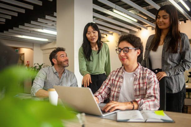 istock Diverse group of young professionals collaborating on company assignment 2170195460