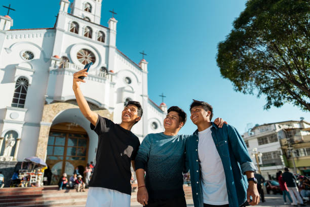 istock Friends taking a selfie using mobile phone on Huaraz, in Peru 2170197461