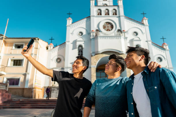 istock Friends taking a selfie using mobile phone on Huaraz, in Peru 2170197464