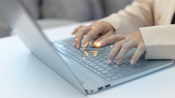 istock A woman is typing on a laptop with a keyboard that has a circle on it 2170198199