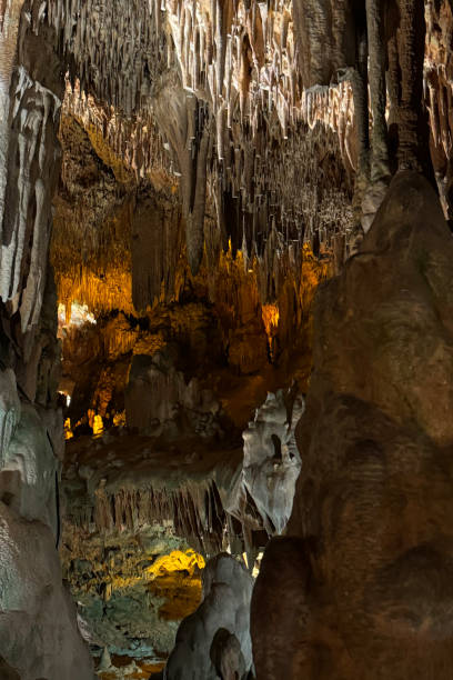istock Cave wall with light, interior of the beautiful cave, abstract background and texture, stalactites and stalagmites, underground, natural water shaped walls 2170199290