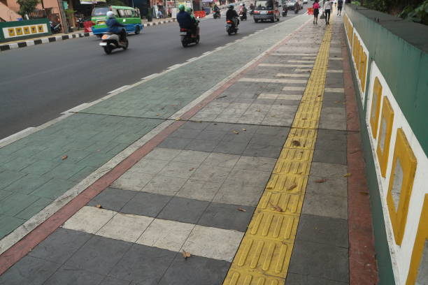 istock Empty sidewalk with tactile paving for blind people 2170199665