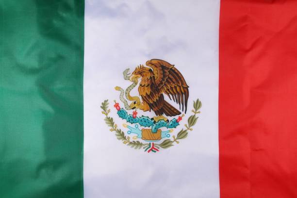 istock A vibrant Mexican flag featuring an eagle perched on a cactus surrounded by a wreath, representing national pride 2170200982
