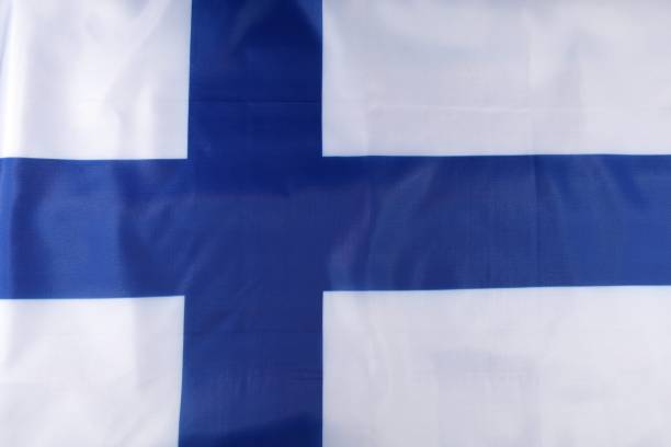 istock Finnish flag displayed prominently, showcasing its blue cross on a white background, symbolizing national pride and identity 2170201224