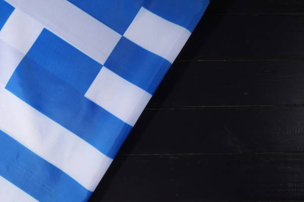 istock Blue and white patterned fabric draped on a black wooden surface, capturing a vibrant contrast during daylight hours 2170201434