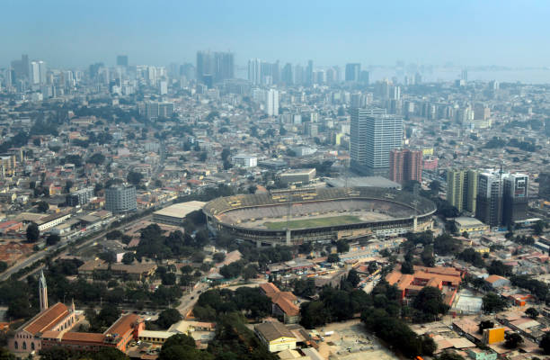 Luanda, Angola: aerial view of the city - in the foreground the Rangel district with Our Lady of Fatima Church, São Domingos School, Saint Paul's Prison, Cidadela Stadium, Eucalyptus Towers and Cidadela Towers, bound by the Cambambe River along Soba Mandume Street - downtown business district and Luanda Bay on the horizon.