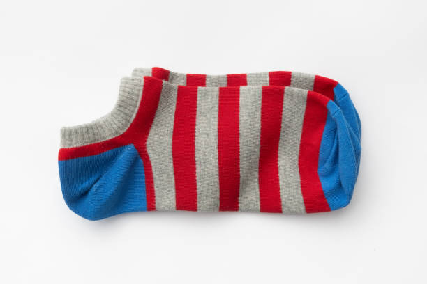 istock Trendy ankle sock featuring blue and dark blue stripes with red toe and heel on a white background, perfect for modern fashion and product design concepts 2170201879