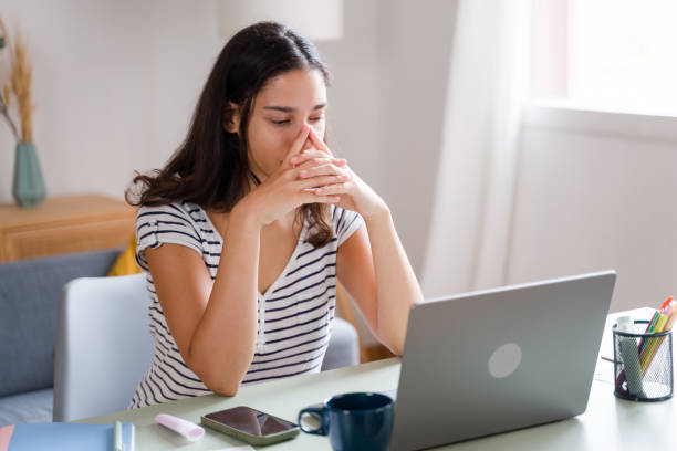 istock woman feeling stressed while working on laptop at home 2170202957