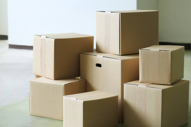 istock Packed cardboard boxes placed in a large room or office 2170203669
