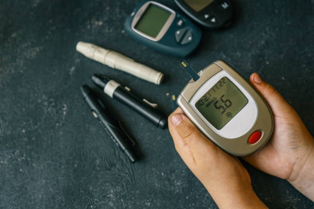 istock Instruments for measuring blood sugar top view on black background 2170205373