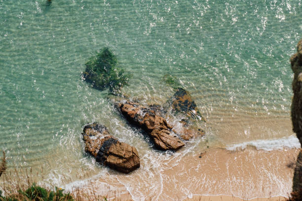 istock View down from cliffs onto the shoreline of the idyllic Pedn Vounder Beach, Cornwall on a bright September day. 2170205653