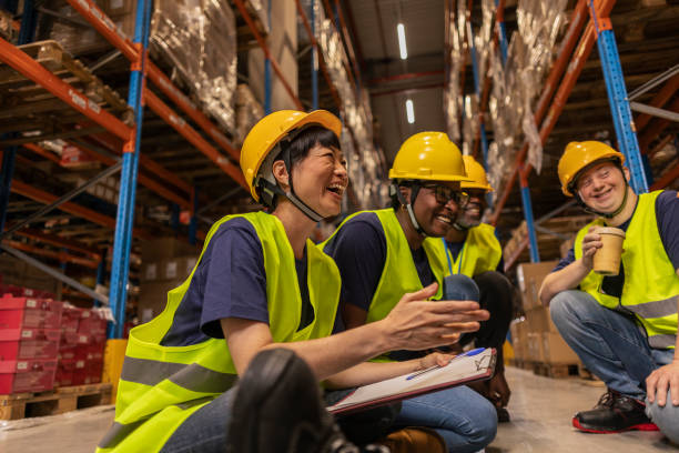 istock Diverse Warehouse Team Taking a Break and Laughing Together 2170206389