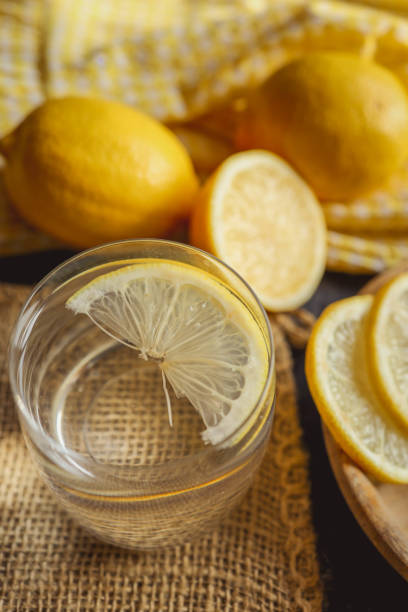 istock Cool freshly made lemonade in glass on wooden table. Space for text 2170207101