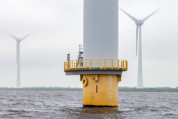istock Offshore windfarm near Dutch coast with cloudy sky 2170208961