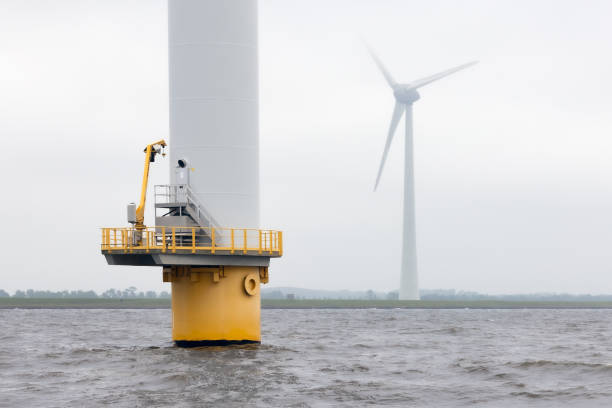 istock Offshore windfarm near Dutch coast with cloudy sky 2170208966