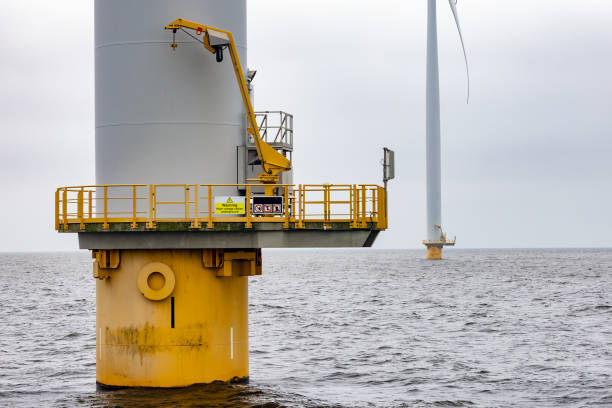 istock Offshore windfarm near Dutch coast with cloudy sky 2170208973