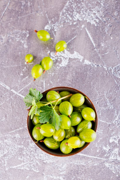 istock fresh organic gooseberries in a wooden bowl 2170209718