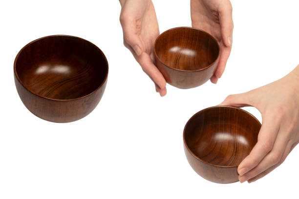 Empty wooden bowl isolated on a white background.