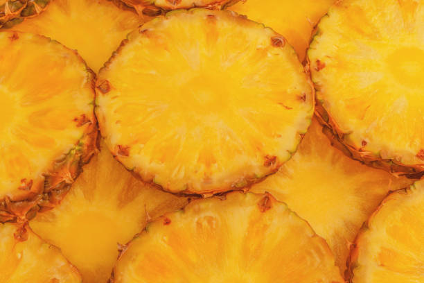 istock Pineapple juicy yellow slices as a background. 2170210981