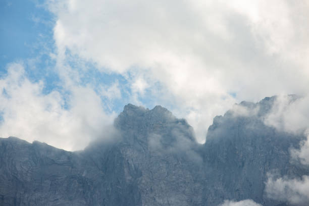 mountain scree ridge in low clouds. climbing concept