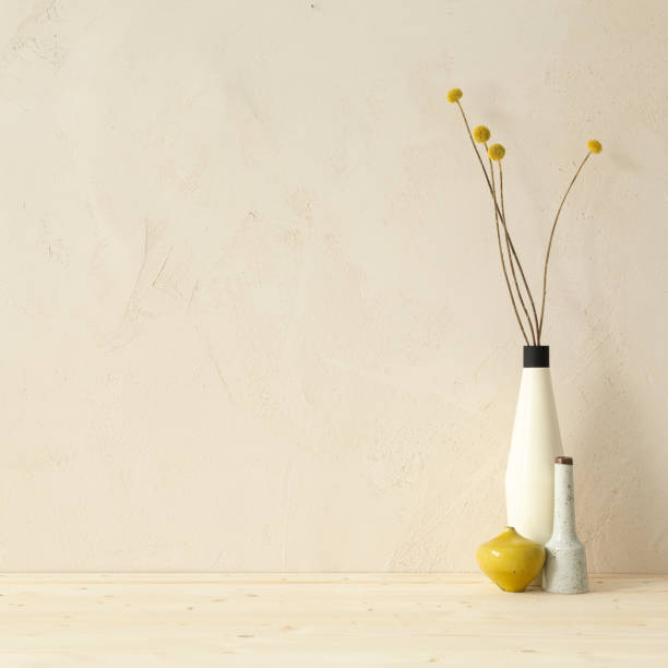 istock Minimal background with light and shadow on the wall. Empty table on beige texture wall with minimal vase with dry twigs. Stylish mock up for presentation, branding products, cosmetics or jewelry. 2170213641