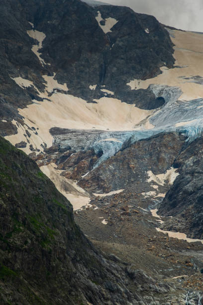 istock a blue glacier within rocky mountain lanscape. travel and trekking 2170214929