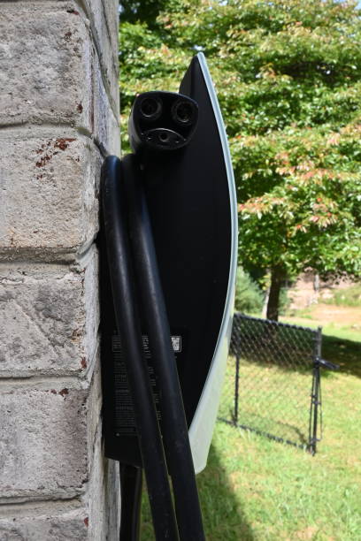 istock Home EV Charger Mounted Outside Against Brick Wall 2170219234