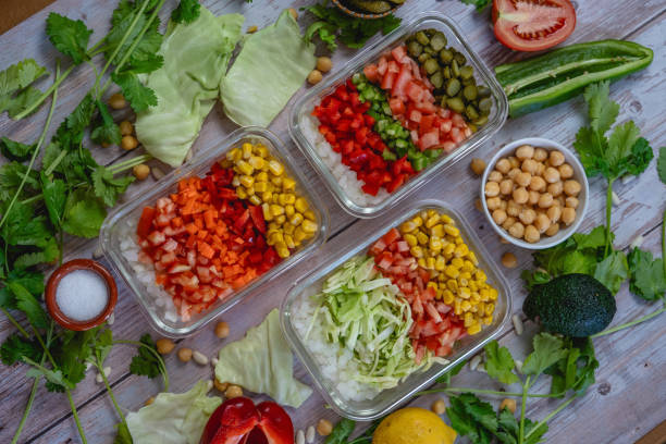 istock different vegetables cut in a bowl. Colorful shades. cabbage, peppers, onion, corn, tomato, pickle. 2170224584