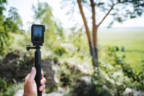 istock A person is using a gimbal stabilizer to hold an action camera in the scenic outdoors. The setting is perfect for capturing nature and wildlife with modern technology 2170226839