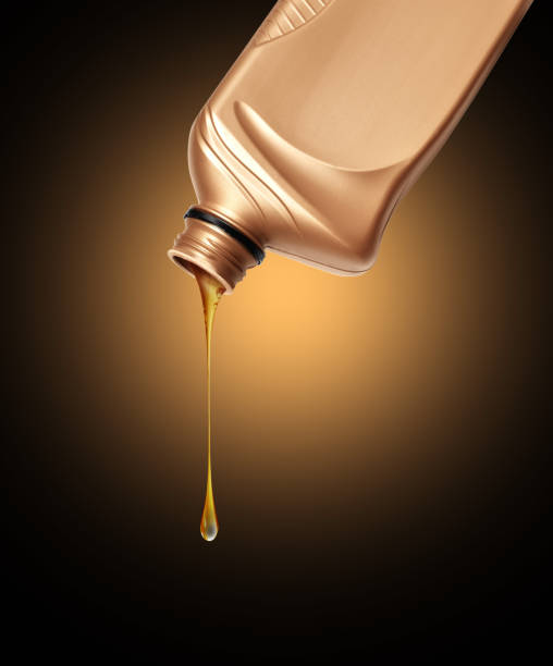 istock Stretched drop of oily liquid dripping from plastic bottle 2170227299
