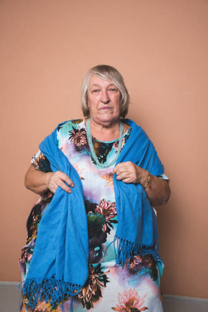 istock Mature woman sitting on a brown background 2170228183